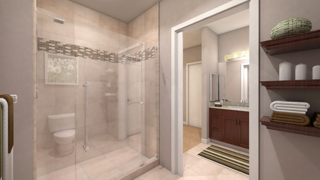 A modern bathroom with a glass-enclosed shower and contemporary vanity.