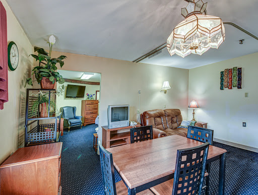 A cozy living and dining space featuring a warm color palette and comfortable furnishings.