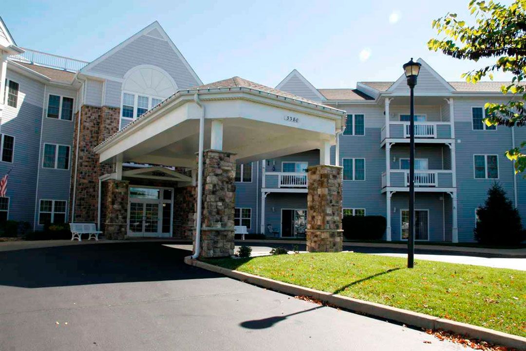 Exterior view of a residential building with a covered entrance.