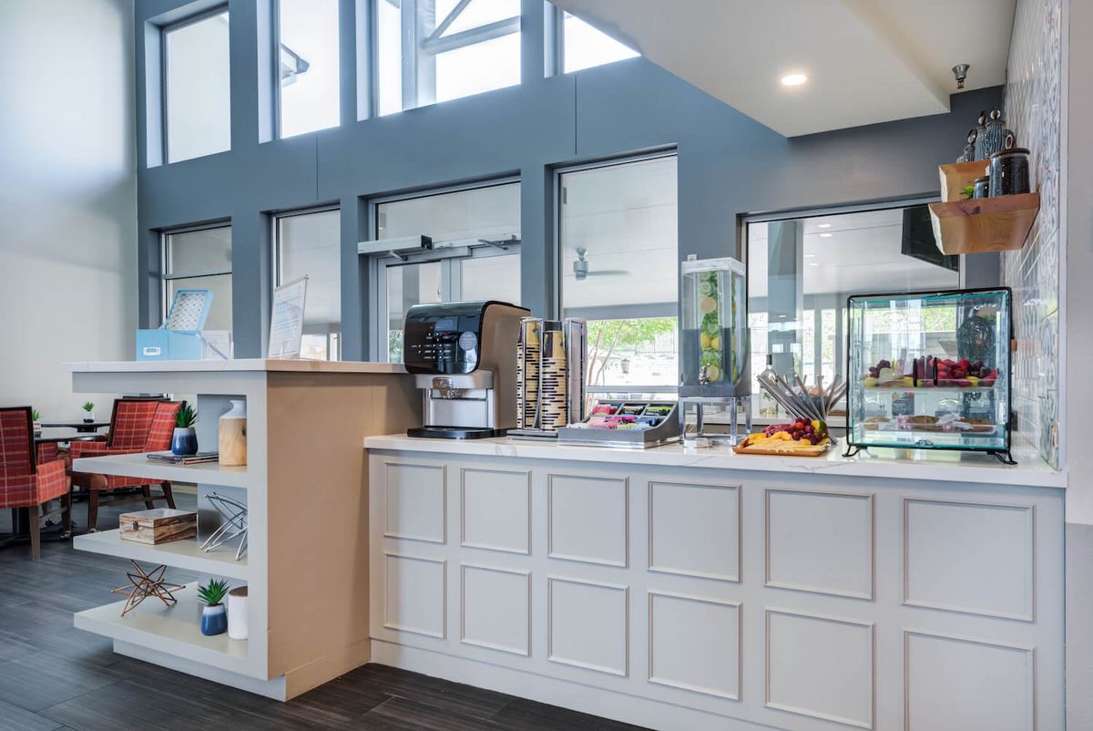 A modern self-service coffee station with a variety of refreshments.