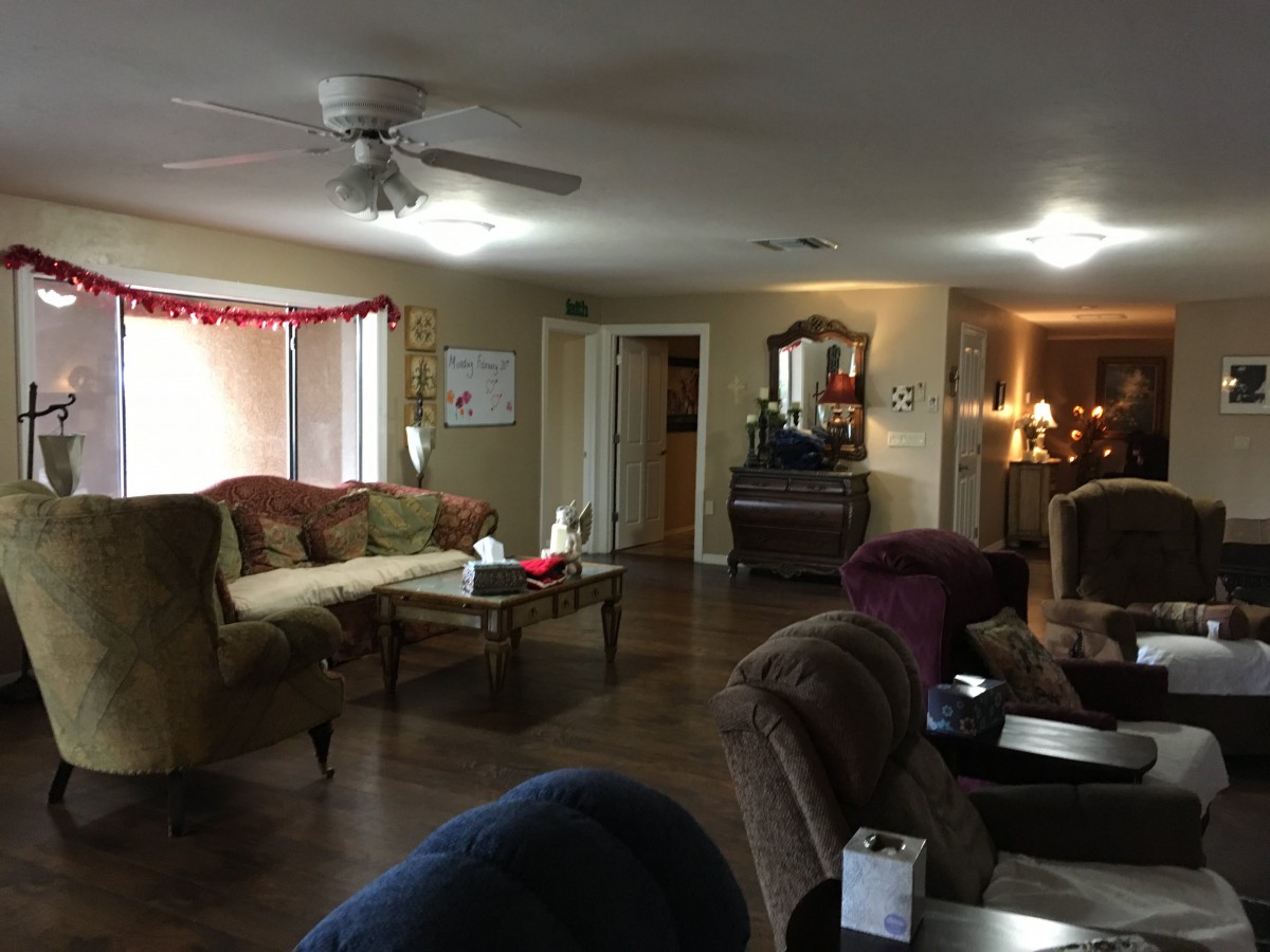A cozy living room with comfortable seating and elegant decor.