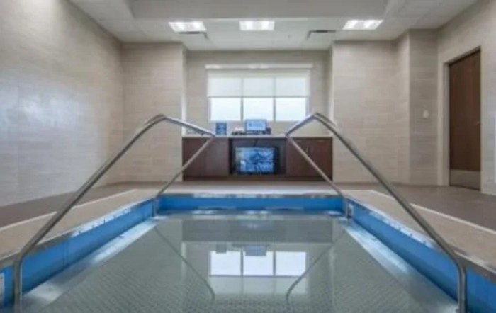 An indoor therapeutic pool designed for relaxation and rehabilitation.