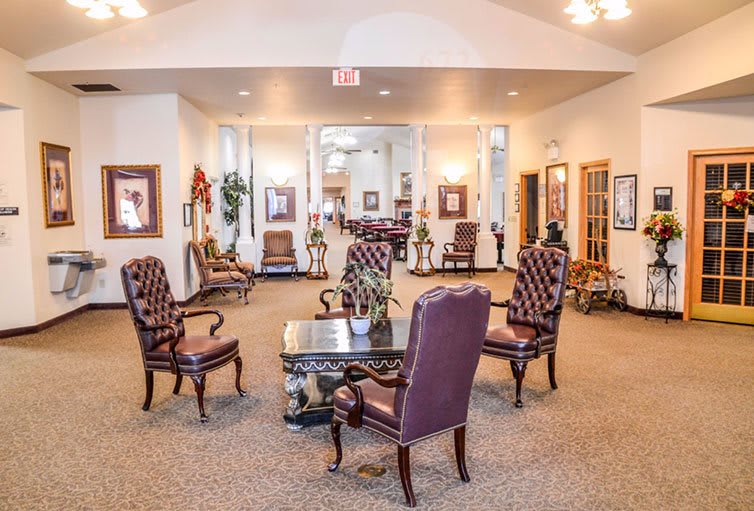 A spacious lobby with elegant seating arrangements and classic decor.