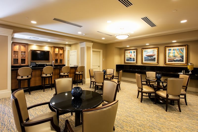 A comfortable lounge area with multiple seating arrangements and elegant decor.