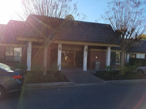 A welcoming entrance to a well-designed building, illuminated by sunlight.