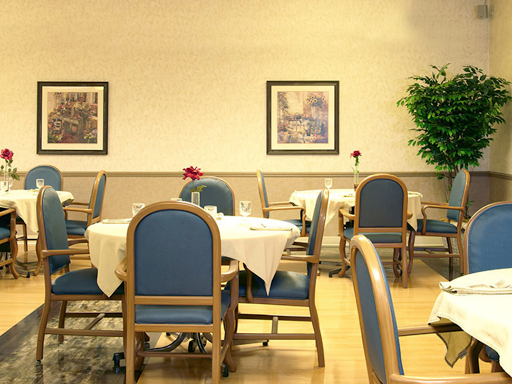 A cozy dining area featuring neatly arranged tables and chairs with decorative elements.
