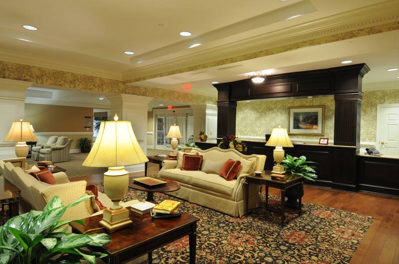 A cozy hotel lobby with comfortable seating and warm lighting.