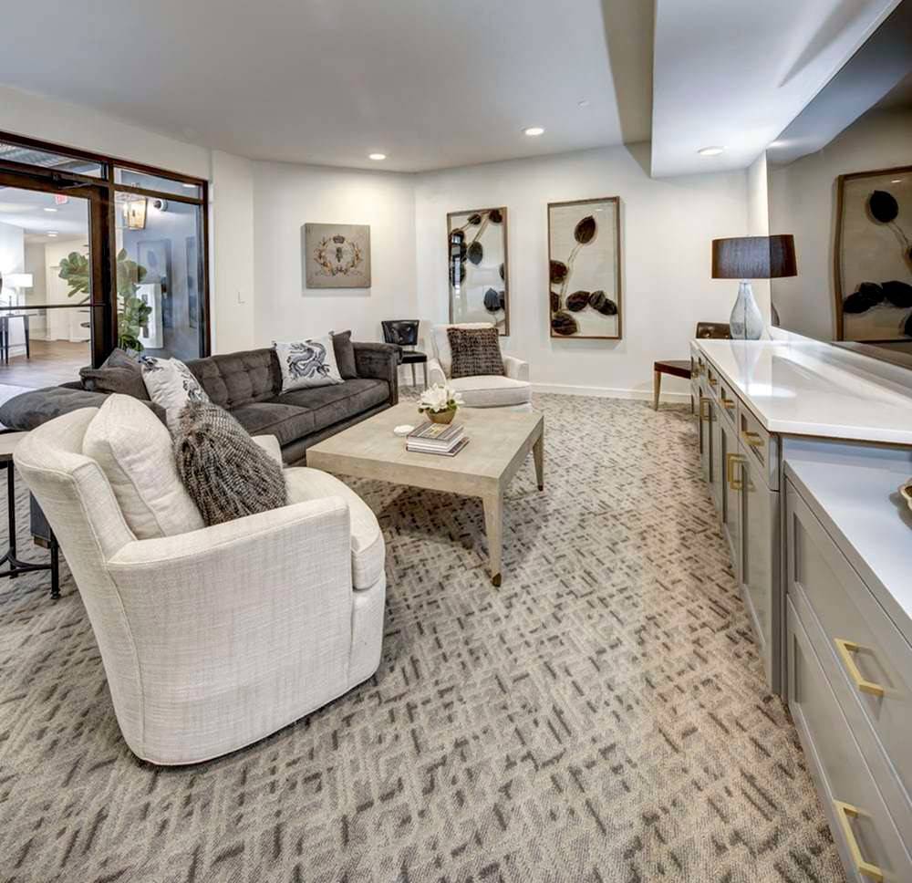 A modern living room with elegant furnishings and contemporary artwork.