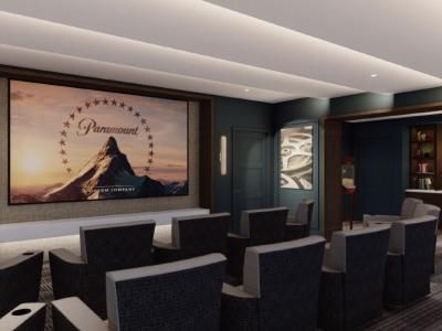 A modern home theater with comfortable seating and a large movie screen.
