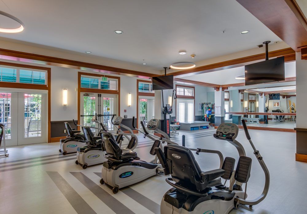 A well-equipped fitness center featuring stationary bikes and treadmills.