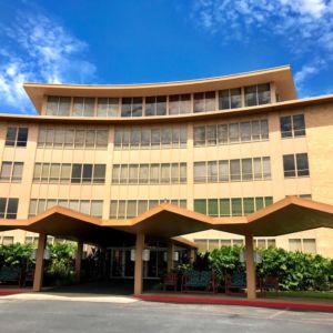 A modernist hotel building with a distinctive facade and entrance.