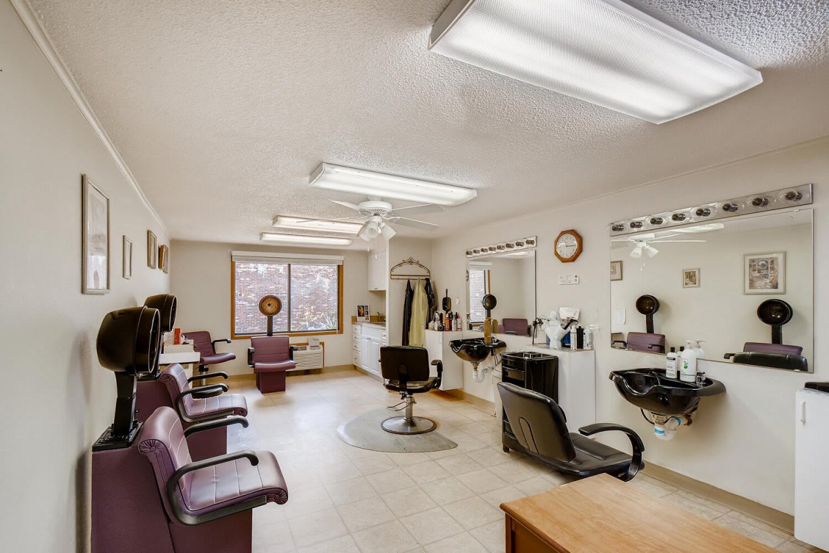 A well-lit hair salon with multiple chairs and mirrors, ready for clients.