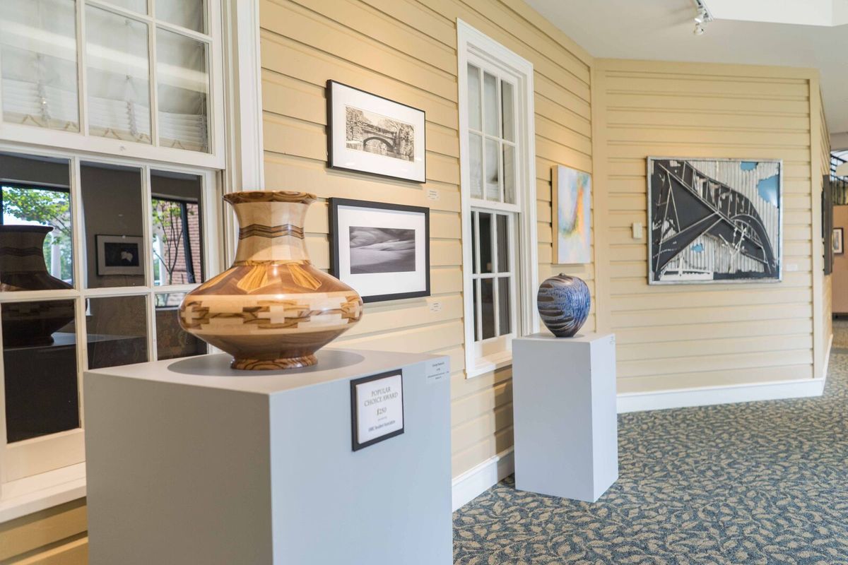 An art gallery showcasing pottery and artwork on display.