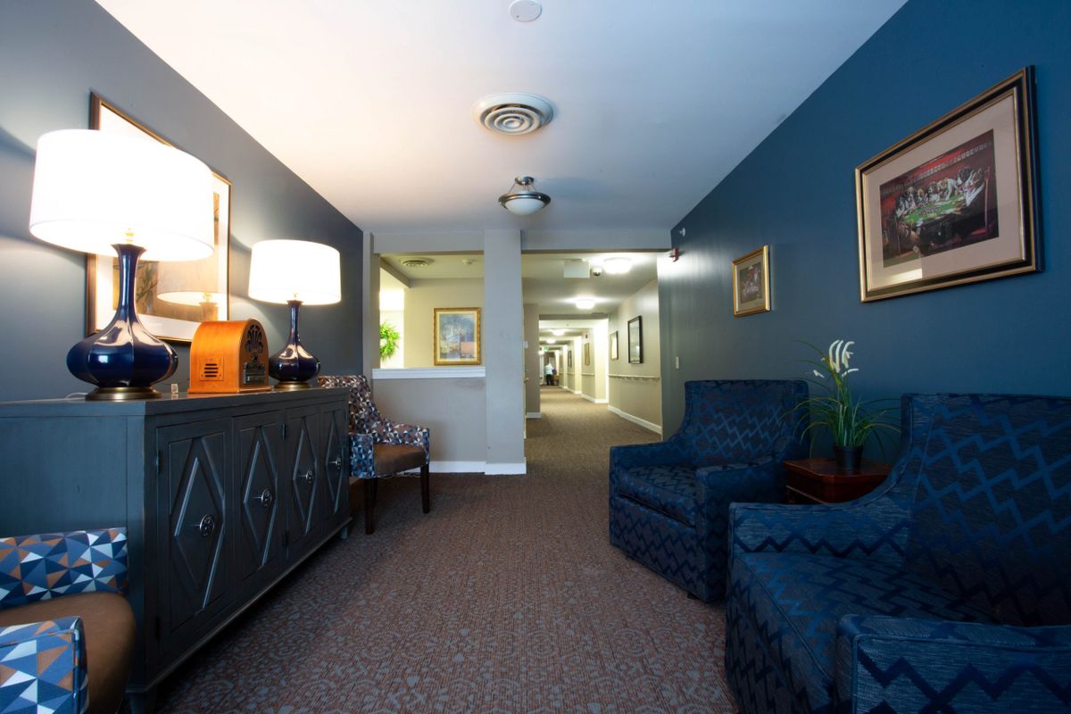 A cozy hallway with comfortable seating and warm lighting.