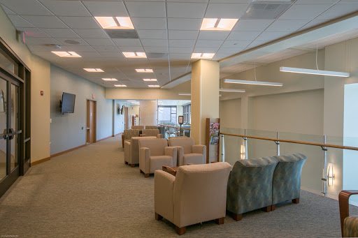 A spacious and inviting lounge area filled with comfortable seating, perfect for relaxation or informal meetings.