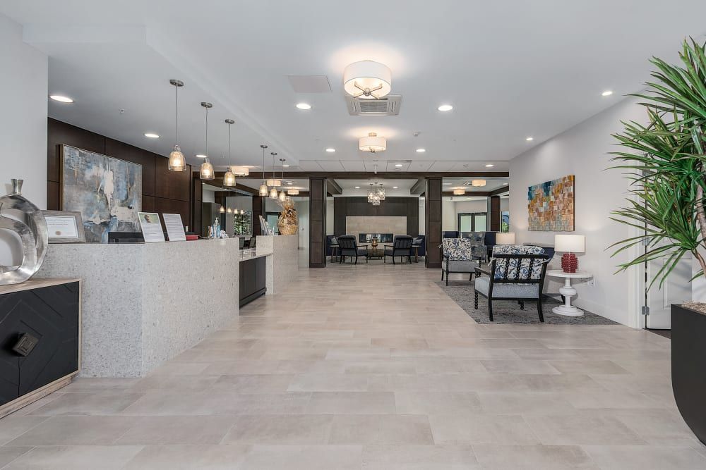 Modern lobby with elegant furnishings and ample lighting.