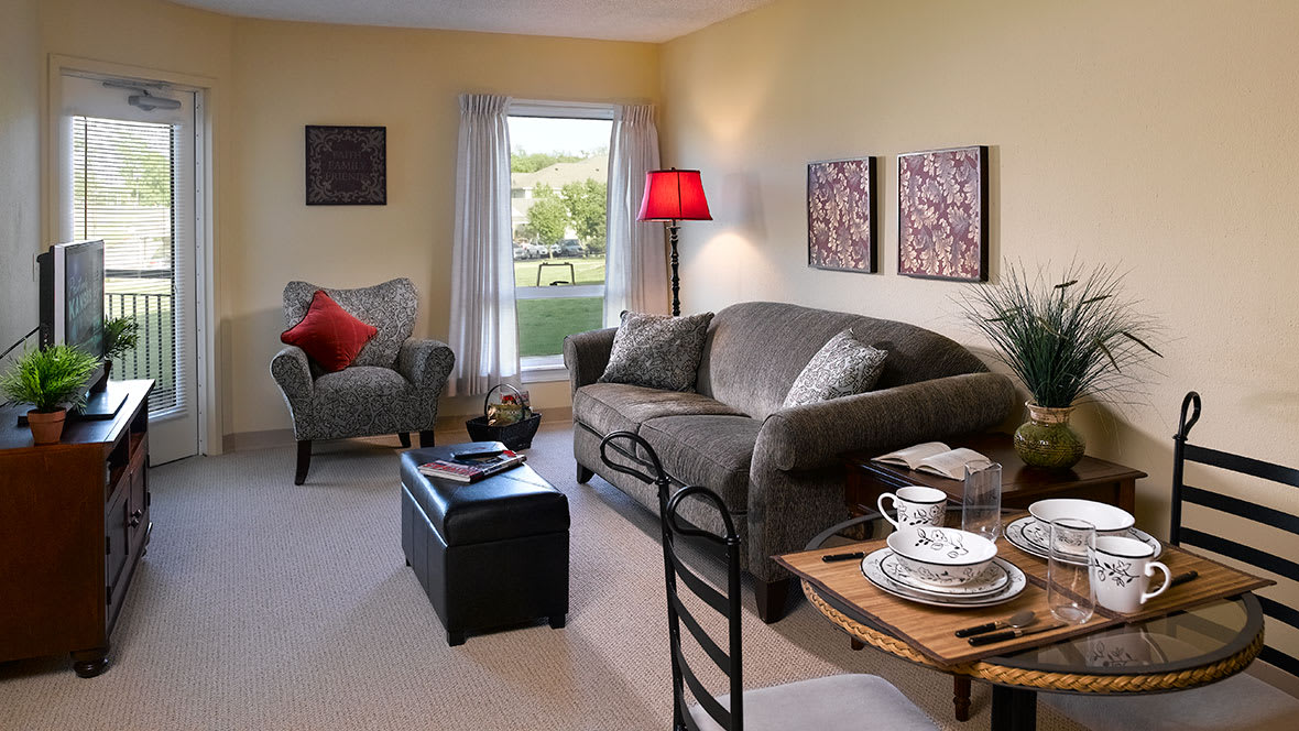 A cozy living room with comfortable seating, warm lighting, and stylish decor.
