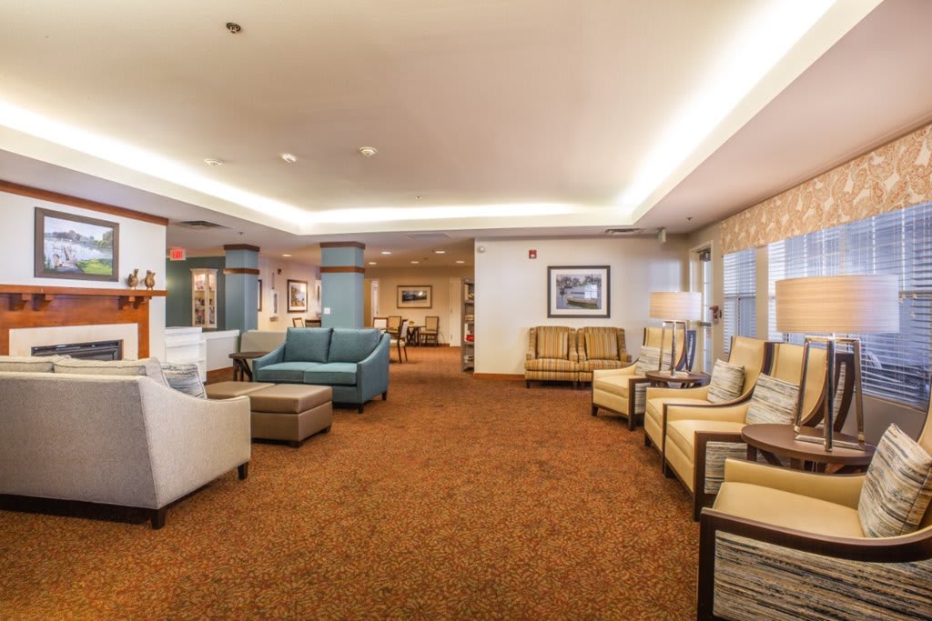 A spacious and elegantly designed hotel lobby with comfortable seating and warm lighting.