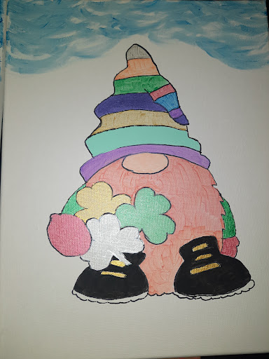 A whimsical gnome character, adorned with a vibrant rainbow hat and playful accessories.