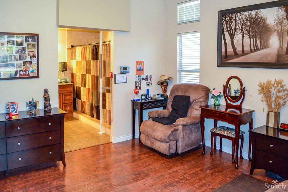 A cozy living room with a recliner chair and warm lighting.