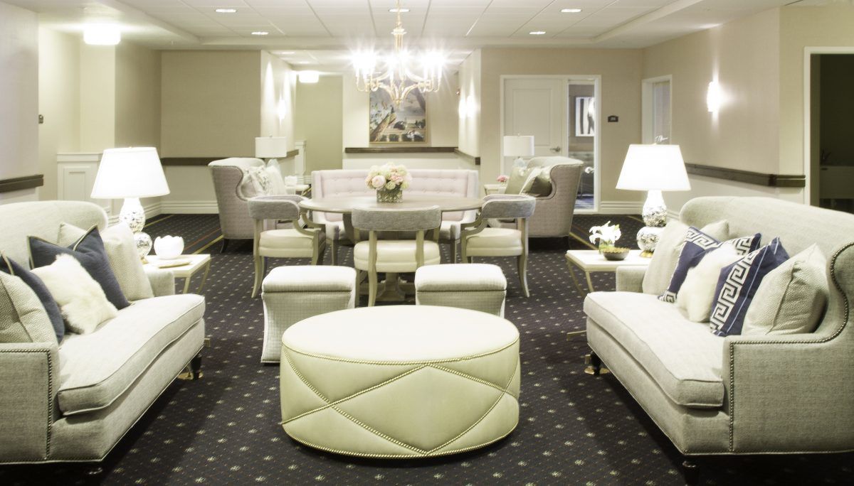A modern living room with elegant, neutral-colored furniture and sophisticated decor.