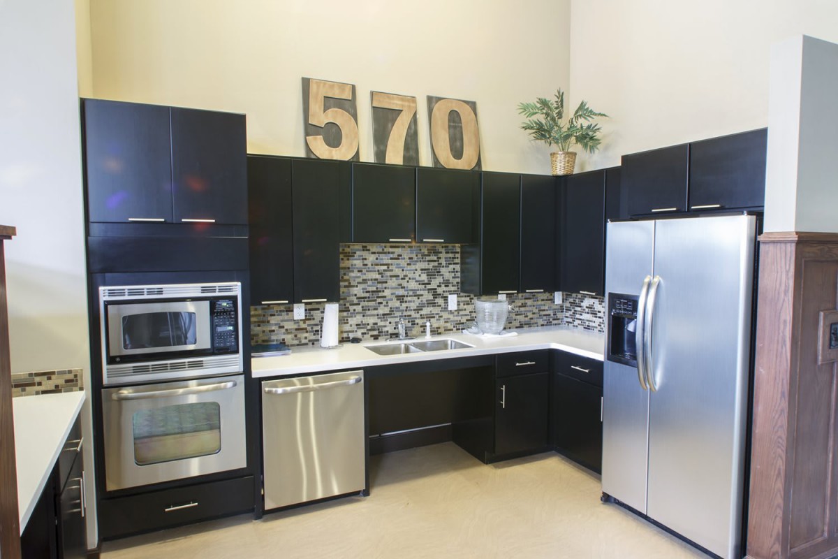 A modern kitchen with stainless steel appliances and sleek cabinetry.