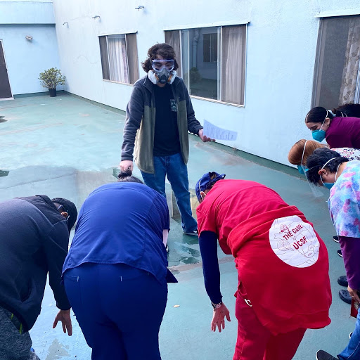 A group of individuals engaged in a collaborative training session outdoors, focusing on teamwork and practice.