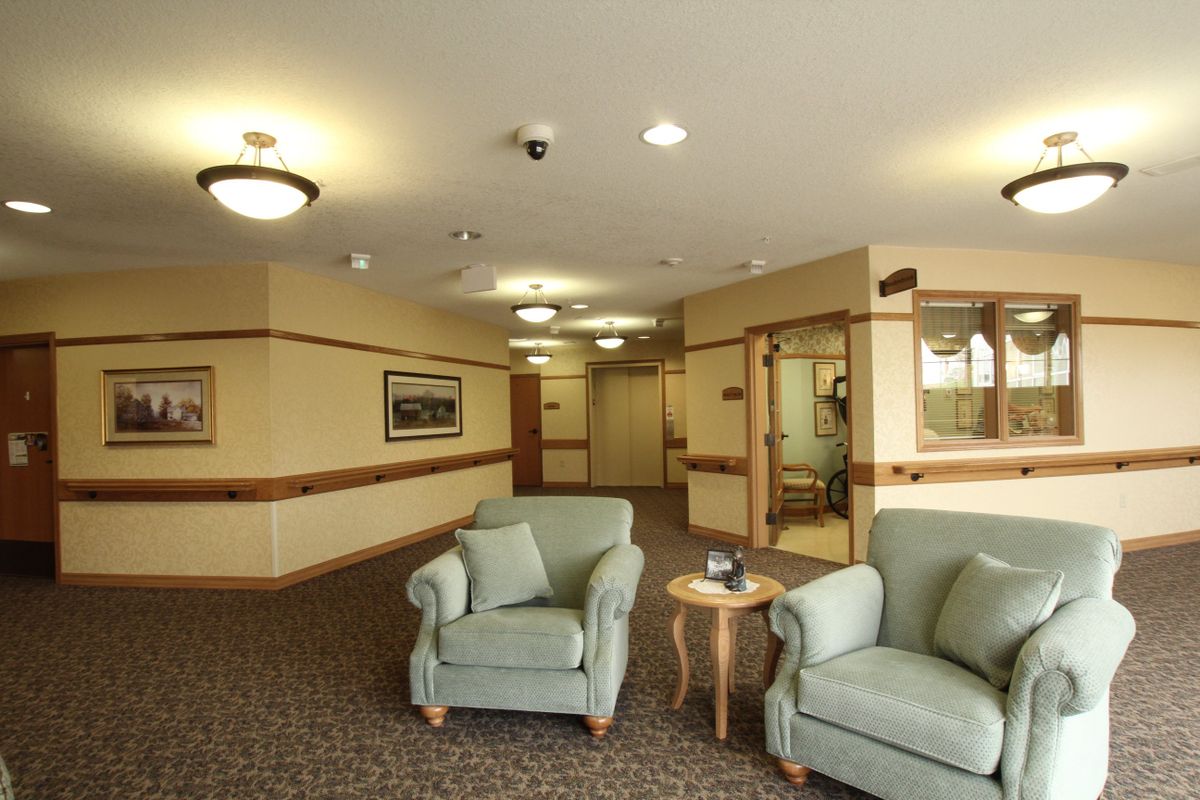 A comfortable lobby area with armchairs and soft lighting.