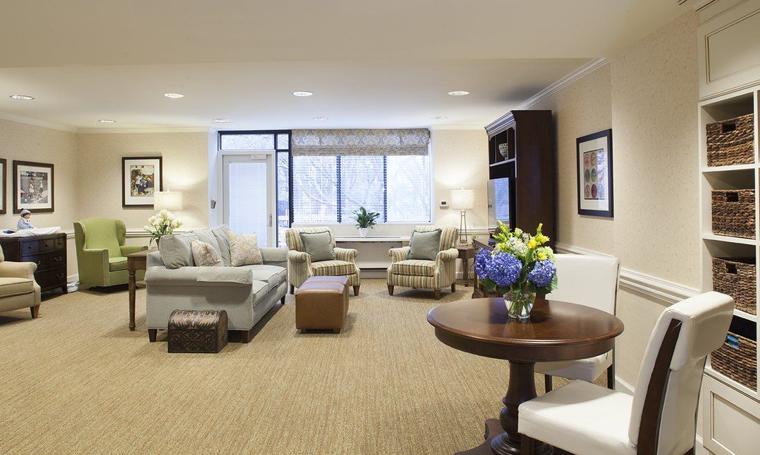 A spacious and elegantly designed modern living room with comfortable seating and tasteful decor.