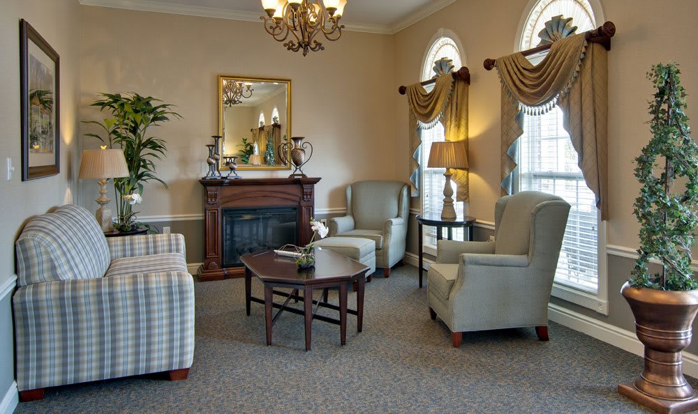 Cozy living room with traditional decor and a fireplace.