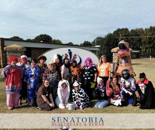 A festive gathering featuring a variety of creative costumes, showcasing community spirit and fun at an outdoor event.