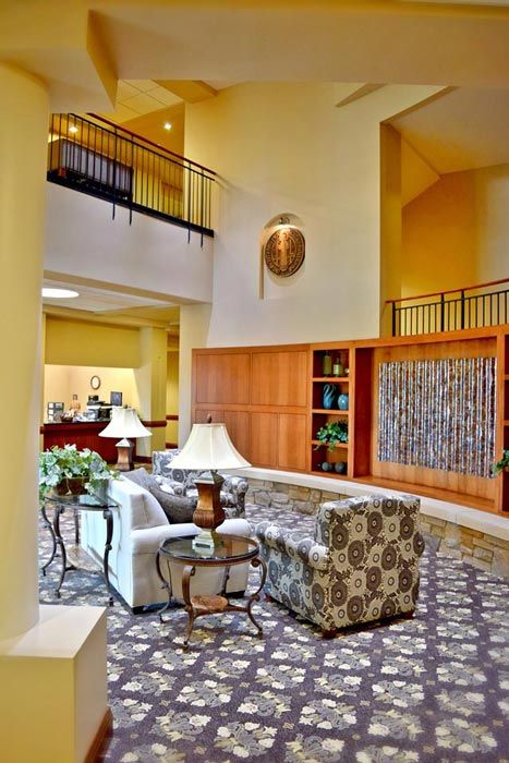 A spacious hotel lobby with comfortable seating and elegant decor.