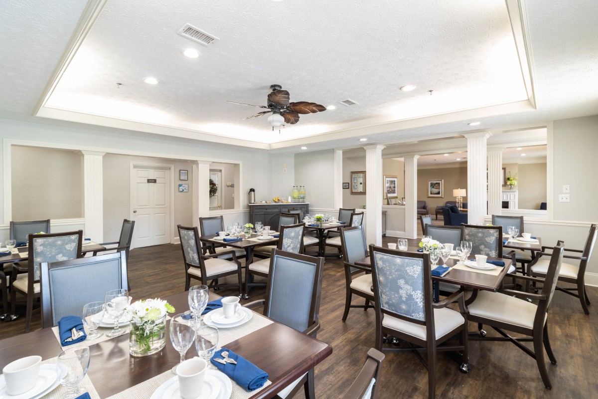 Elegant dining area with neatly set tables and comfortable seating.