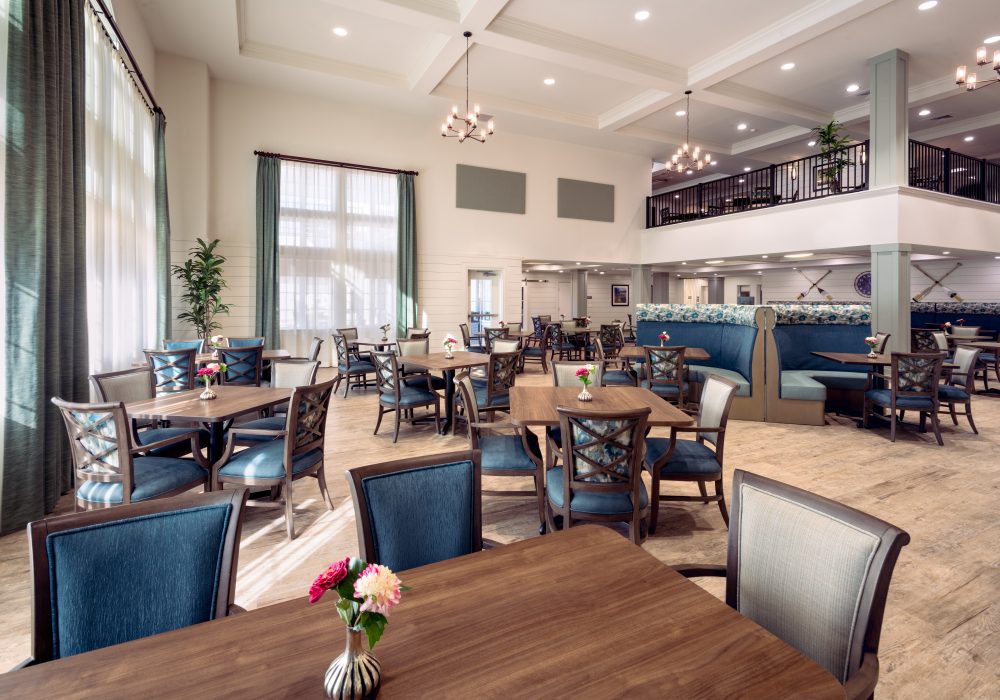 A spacious and elegantly designed restaurant dining area with modern furnishings.
