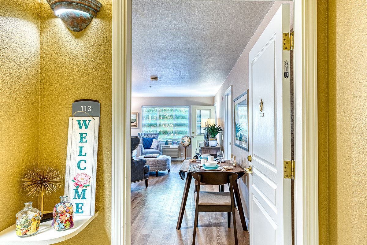 A cozy living room with a dining area, welcoming ambiance, and stylish decor.