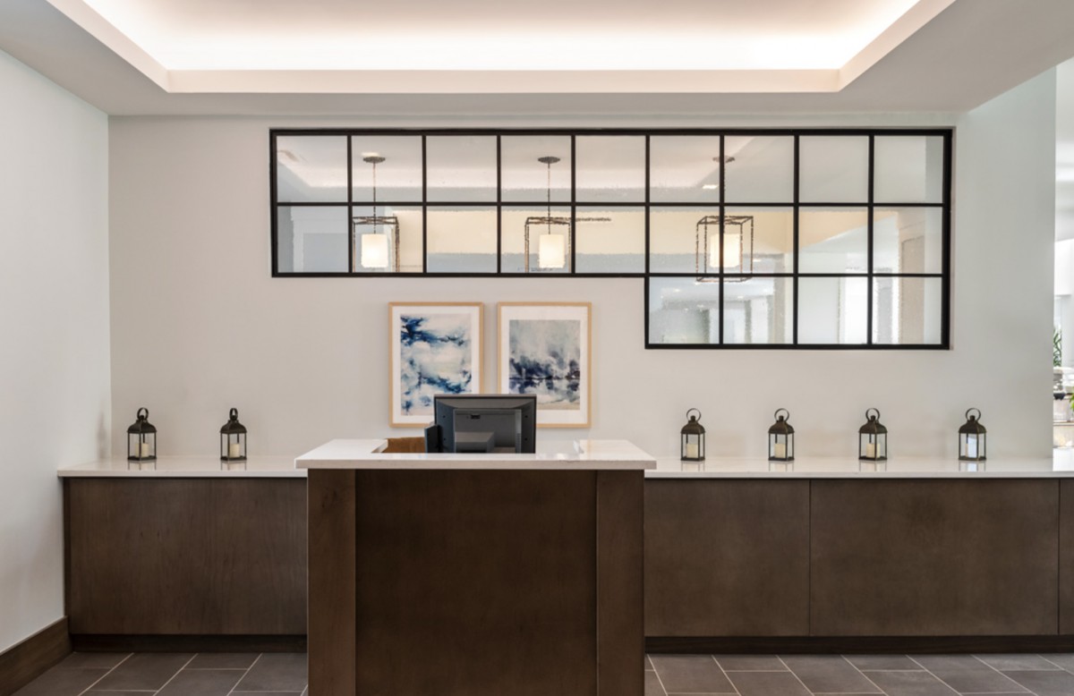 Modern reception area with minimalist design and decorative elements.