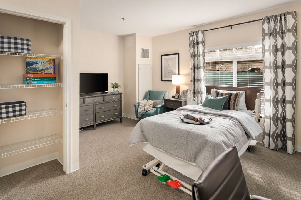 A cozy, modern bedroom with stylish furniture and decor.