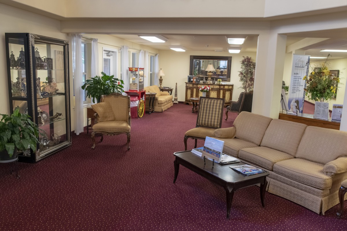 A well-furnished lobby with comfortable seating and decor.