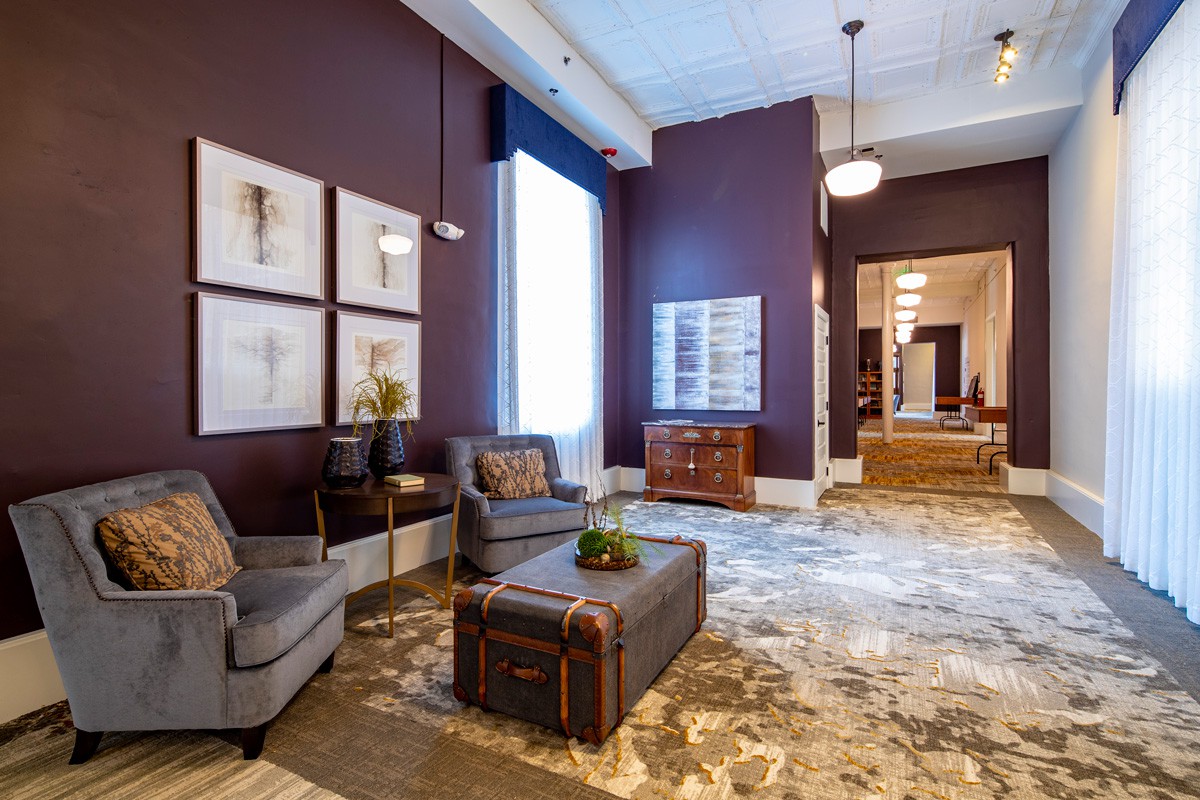 A stylish hotel lobby with modern furniture and elegant decor.
