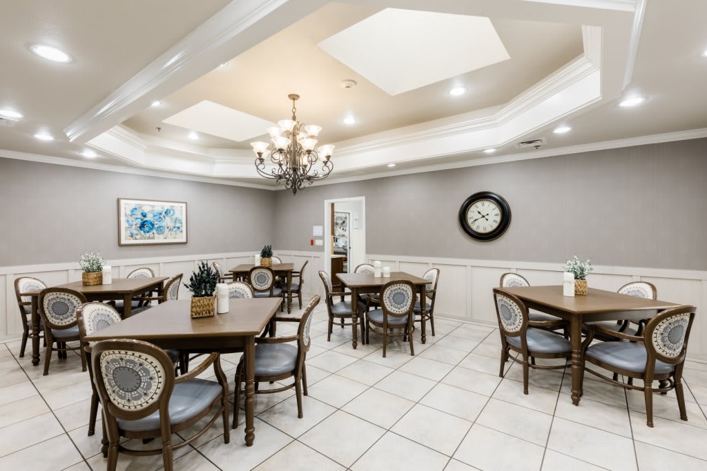 A well-lit dining area with classic furniture and stylish decor.
