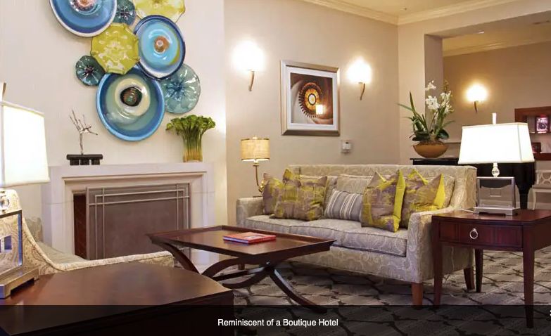 A modern living room with chic decor reminiscent of a boutique hotel.
