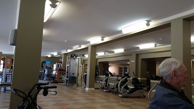 A well-equipped gym with various exercise machines and equipment.