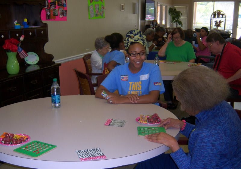 People enjoying a game of bingo at a community event.