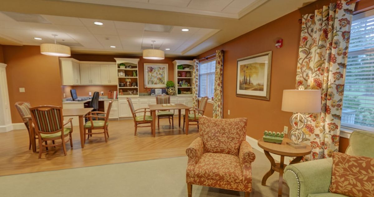 A cozy living room with warm tones and comfortable furniture.