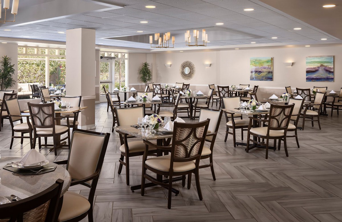An elegant restaurant dining area with neatly arranged tables and chairs.
