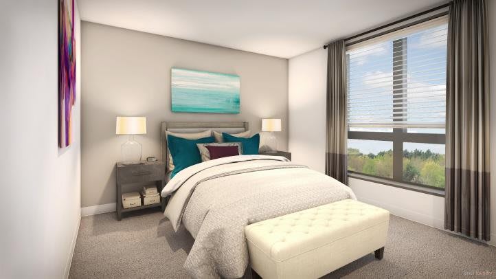 A modern bedroom with stylish decor and large window views.