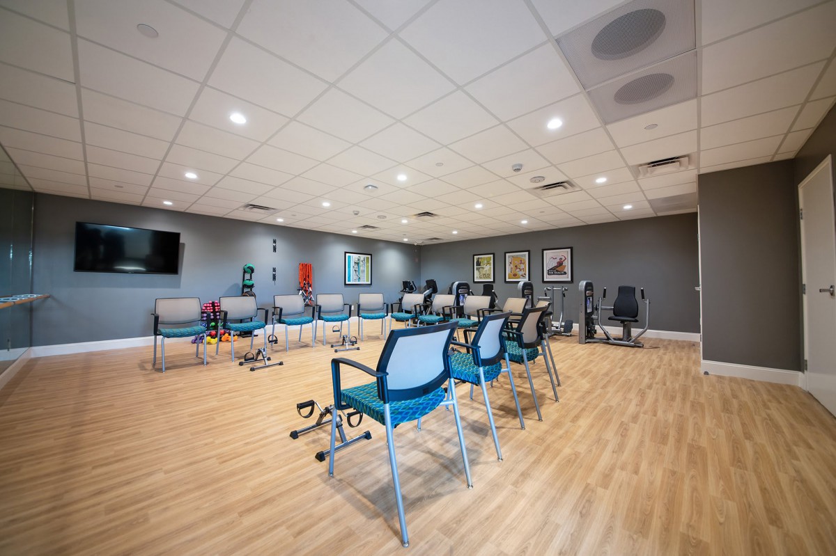 A modern conference room with chairs arranged in a circle for a meeting.
