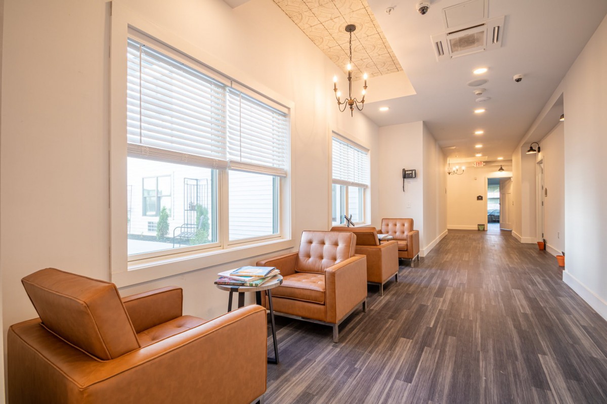 A modern waiting area with comfortable lounge chairs and natural lighting.