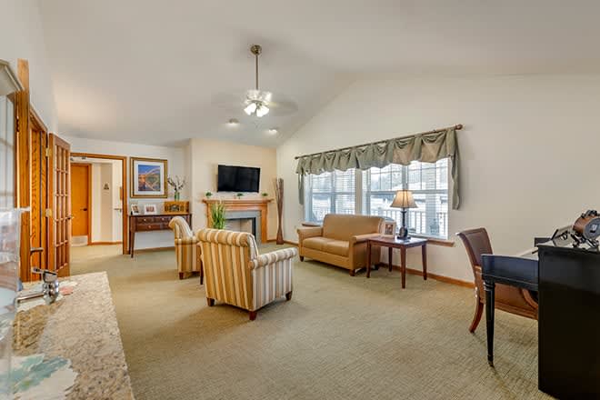 A cozy living room with comfortable furniture and natural light.