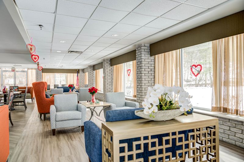 A bright and modern living room with comfortable seating and decorative elements.